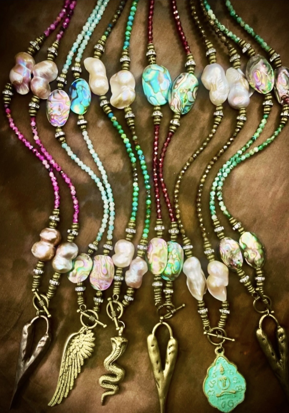 Colorful gemstone and pearl lovebeads with sculptural charms