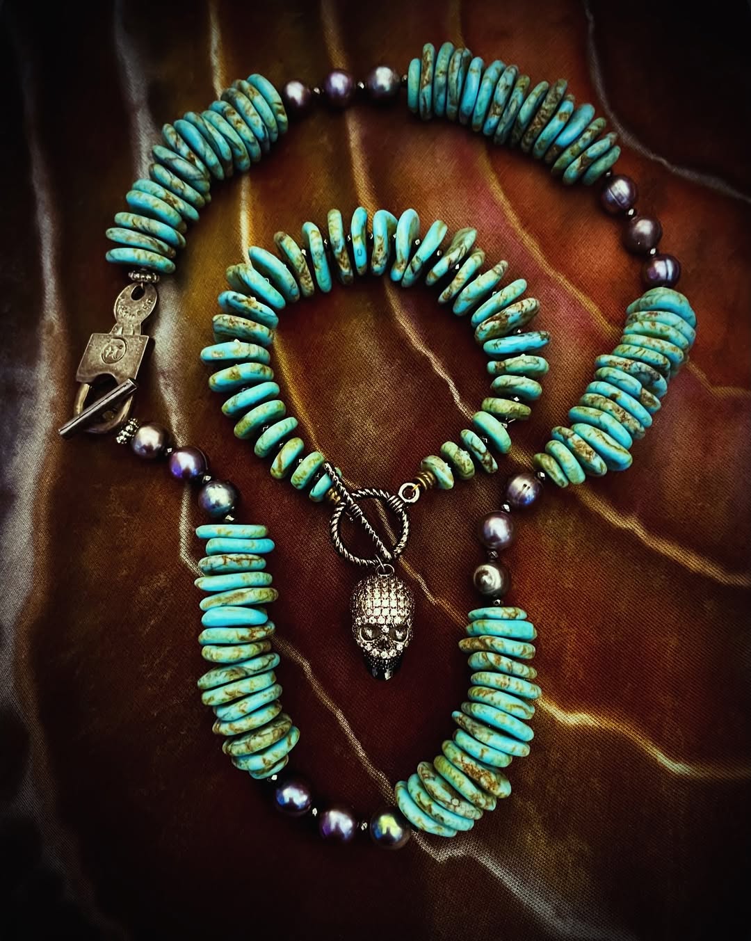 Turquoise and pearl jewelry set with a skull charm